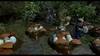 A group of Lego characters in a jungle setting, examining dinosaur eggs in nests. Náhled obrázku produktu