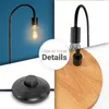 A collage of images showing details of a minimalist floor lamp, including the bulb, stem, base, and foot switch. Produktbild-Vorschau