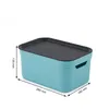 A blue storage box with a black lid is shown against a white background, with dimensions indicated by lines and text. Produktbild-Vorschau