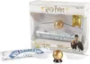 A Harry Potter themed toy set featuring a flying snitch and a Quidditch broomstick, presented in its retail packaging. Produktbild-Vorschau