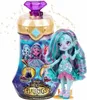 A toy doll and its packaging are displayed against a white background with sparkling accents. Podgląd zdjęcia produktu