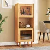 A bamboo cabinet with glass doors, displaying bottles and kitchenware. Produktbild-Vorschau