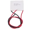 A square white thermoelectric generator module with red and black wires attached, isolated on a white background. Podgląd zdjęcia produktu