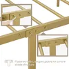 Close-up view of a gold metal bed frame assembly, showing L-shaped plates and screws. Produktbild-Vorschau