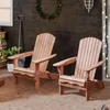 Two wooden Adirondack chairs on a tiled patio, decorated for the holidays. Produktbild-Vorschau