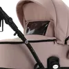 A close-up view of a beige baby stroller. Produktbild-Vorschau