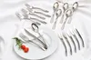 A collection of cutlery laid out on a white cloth background. Produktbild-Vorschau