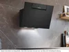 A black Siemens range hood mounted on a marble-patterned wall above a countertop. Voir les images du produit