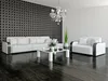 A modern living room with a patterned wallpaper, white sofas, and a coffee table. Anteprima dell’immagine prodotto