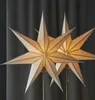 Two star-shaped lamps are displayed against a dark gray curtain background. Podgląd zdjęcia produktu