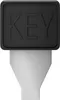 A close-up studio shot of a black and silver universal power adapter. Náhľad obrázku produktu