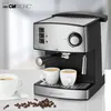 A Clatronic espresso machine is shown on a white countertop, with two cups of coffee and coffee beans in the foreground. Náhľad obrázku produktu