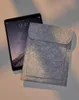 A tablet and a felt sleeve are placed on a light-colored surface. Produktbild-Vorschau