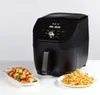 A black Instant Pot Vortex Slim Airfryer is shown on a white surface, with a plate of chicken skewers and a plate of french fries in front of it. Produktbild-Vorschau