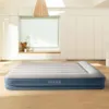 An inflatable mattress is shown in a room with white walls and wooden floors. Náhľad obrázku produktu