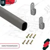 Product image showing a gray oval rod, two metal brackets, and screws, with a blueprint of a house in the background. Náhľad obrázku produktu