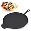 A cast iron griddle pan is shown in the foreground, with a plate of crepes topped with berries and chocolate sauce in the background. Produktbild-Vorschau