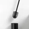 A black toilet brush and holder against a white background. Anteprima dell’immagine prodotto