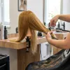 Cvičná kadeřnická hlava Ela s přírodními vlasy 60 cm a Náhled obrázku produktu 4