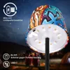 A graffiti-decorated LED lamp is shown outdoors at night, with tents and people in the background. Anteprima dell’immagine prodotto