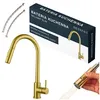 A gold kitchen faucet and its packaging are displayed against a white background. Náhled obrázku produktu