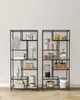 Two tall, black metal shelving units filled with various home decor and kitchen items, set against a plain light gray wall. Náhled obrázku produktu
