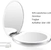 A white compact makeup mirror with LED lighting and a USB charging cable, shown open with text describing its features. Produktbild-Vorschau