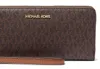 A close-up view of a brown Michael Kors wallet with a gold logo. Podgląd zdjęcia produktu