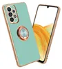 A turquoise phone case with a gold trim and a gold ring holder is shown diagonally against a white background. A smartphone screen with an abstract orange and yellow pattern is visible on the right side of the image. Náhľad obrázku produktu
