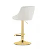 A beige upholstered bar stool with a gold base and stem, shown from the side against a white background. Produktbild-Vorschau
