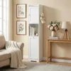A tall, narrow white cabinet is shown in a room with a sofa and a side table. Voir les images du produit