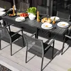 An outdoor dining set with a table and chairs set up on a wooden deck, with food and drinks on the table. Náhled obrázku produktu