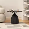 A black side table with a tissue box and a glass on top, placed on a rug in a room. Podgląd zdjęcia produktu