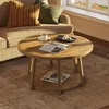 A living room scene with a couch, coffee table, and rug. Produktbild-Vorschau