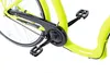 A close-up view of the pedal and chain guard of a bicycle. Produktbild-Vorschau