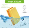 An air filter is shown partially submerged in water, with text overlay indicating "WASH & REUSE" and suggestions for cleaning and replacement. Produktbild-Vorschau