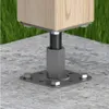 A close-up view of a metal post anchor securing a wooden post to a concrete surface, with grass in the background. Náhľad obrázku produktu
