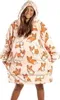 A woman wearing a hooded blanket with a corgi print. Anteprima dell’immagine prodotto