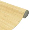 A rolled-up bamboo mat on a white background. Podgląd zdjęcia produktu