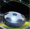 A large hoverball shaped like a soccer ball is shown on a soccer field at night, with stadium lights illuminating the scene. Produktbild-Vorschau