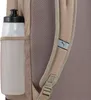 A close-up view of a backpack's side pocket holding a water bottle, with a shoulder strap visible. Anteprima dell’immagine prodotto