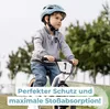 A young boy riding a bicycle wearing a helmet. Produktbild-Vorschau