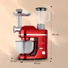 A red kitchen mixer with a meat grinder attachment and a blender jug, with dimensions indicated by lines and text. Produktbild-Vorschau