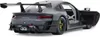 A close-up, rear-view shot of a gray Porsche 911 GT2 RS Clubsport 25 model car with its driver's side door open. Podgląd zdjęcia produktu