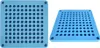 Two views of a blue capsule filling tray with many circular indentations. Náhled obrázku produktu