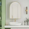 A modern bathroom vanity with a sink, faucet, and arched mirror. Anteprima dell’immagine prodotto