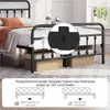 A metal bed frame with a mattress and storage baskets underneath. A close-up inset shows a detail of the mattress stoppers. Text and diagrams explain the function of the stoppers. Produktbild-Vorschau