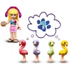 A Lego Friends character with headphones and a cookie, thinking about four different colored flamingos. Anteprima dell’immagine prodotto