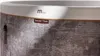 A close-up view of the side of a MSpa Whirlpool Cocoon, showing the texture of the material and branding. Náhled obrázku produktu
