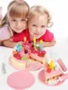 Two young girls are posing with a toy birthday cake. Anteprima dell’immagine prodotto